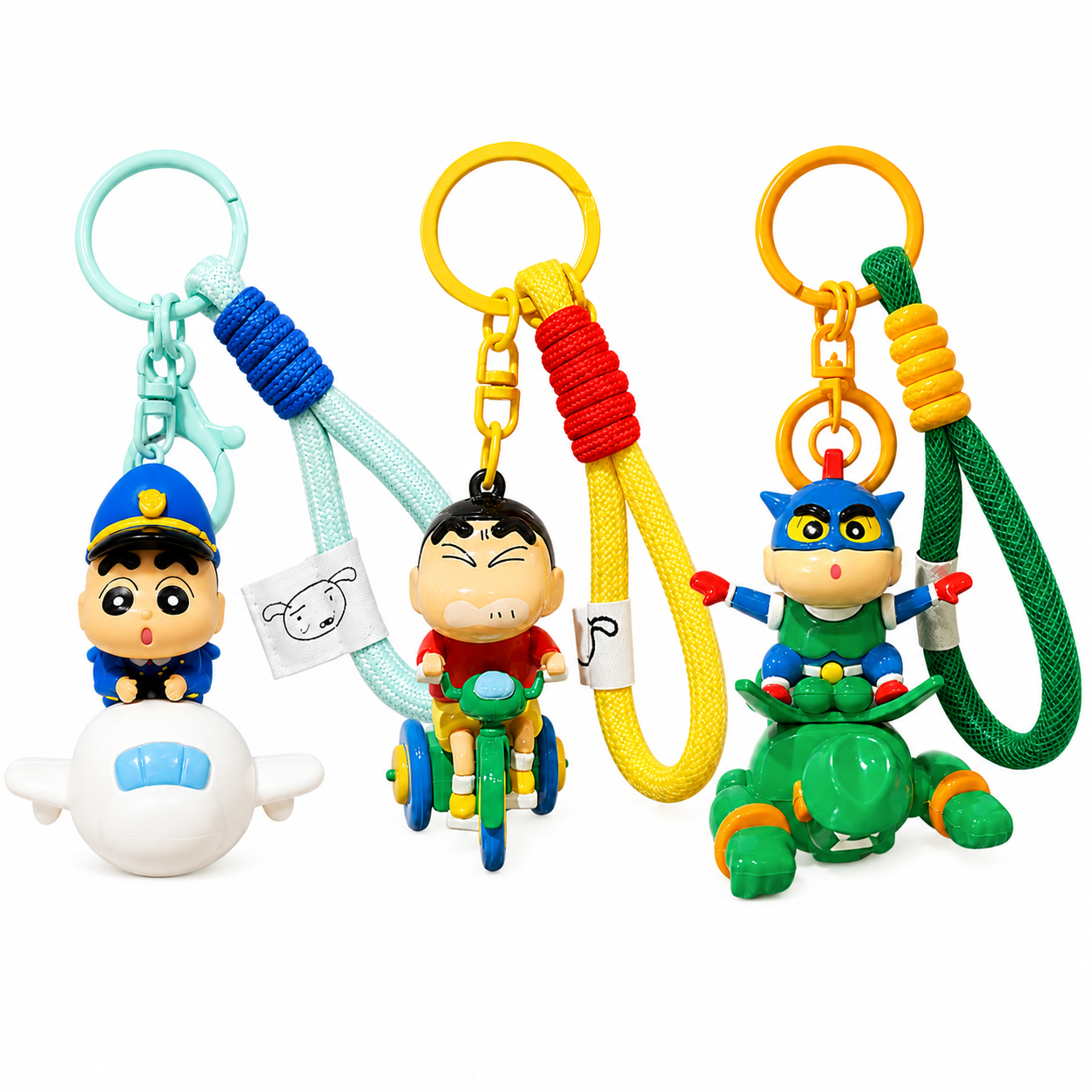 Three colorful keychains with cartoon characters on a white background